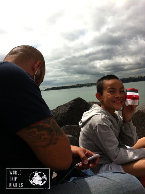 Meeting at the beach, Angelo on the headphones and Jose playing with a paper boat